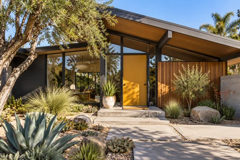 A midcentury home with a landscaped courtyard