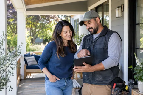 A homeowner discussing work with a contractor