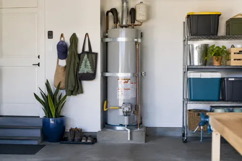 A water heater in a garage